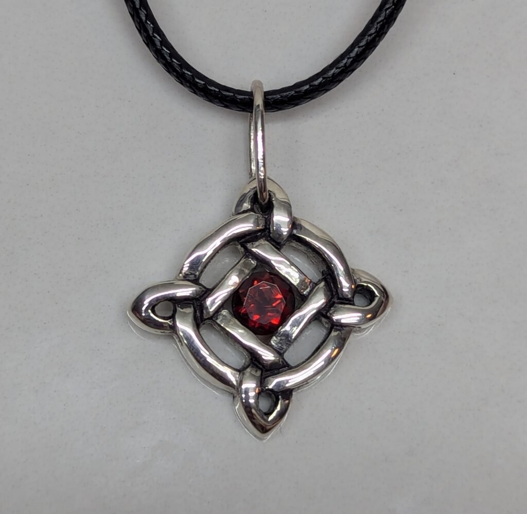 Knotted circle garnet pendant
