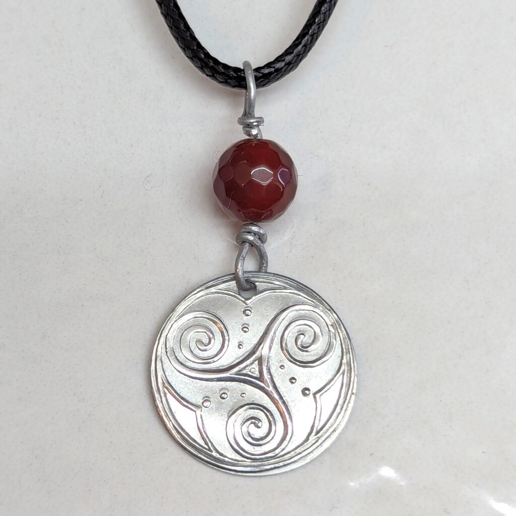 Spirals & Whale Tails and carnelian bead pendant